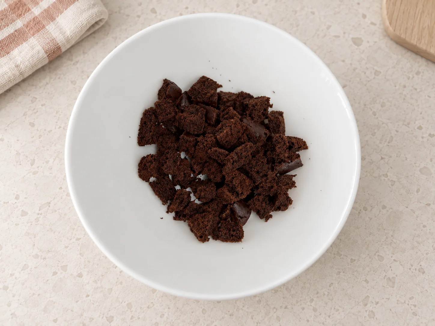 Cake edge trimmings in a white bowl