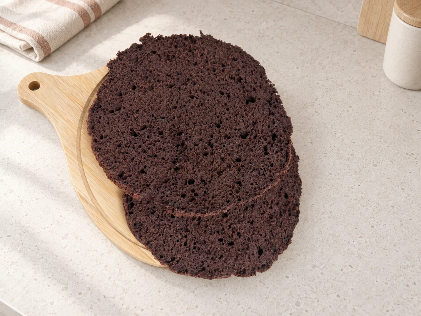 Cut chocolate cake layer