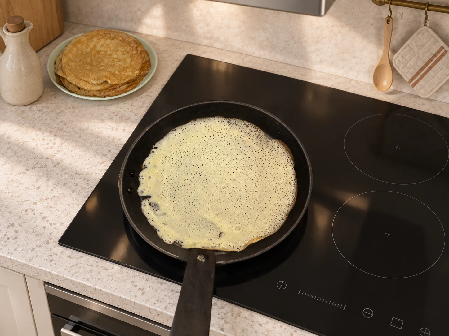 Crepe setting in a pan with small holes appearing on the surface